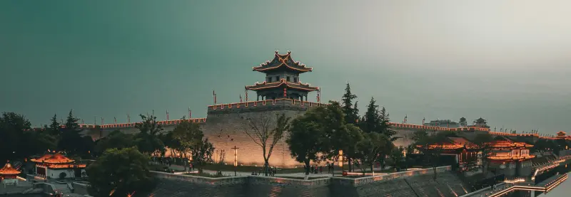 A large building sitting on top of a body of water