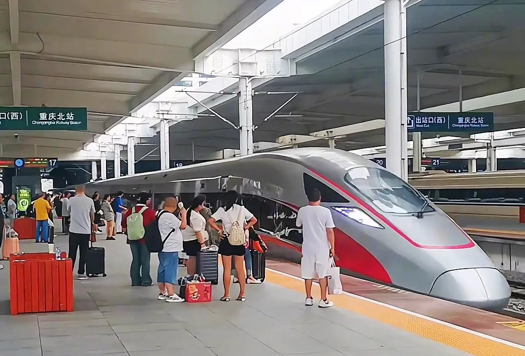 Passengers Boarding High-Speed Train on Platform