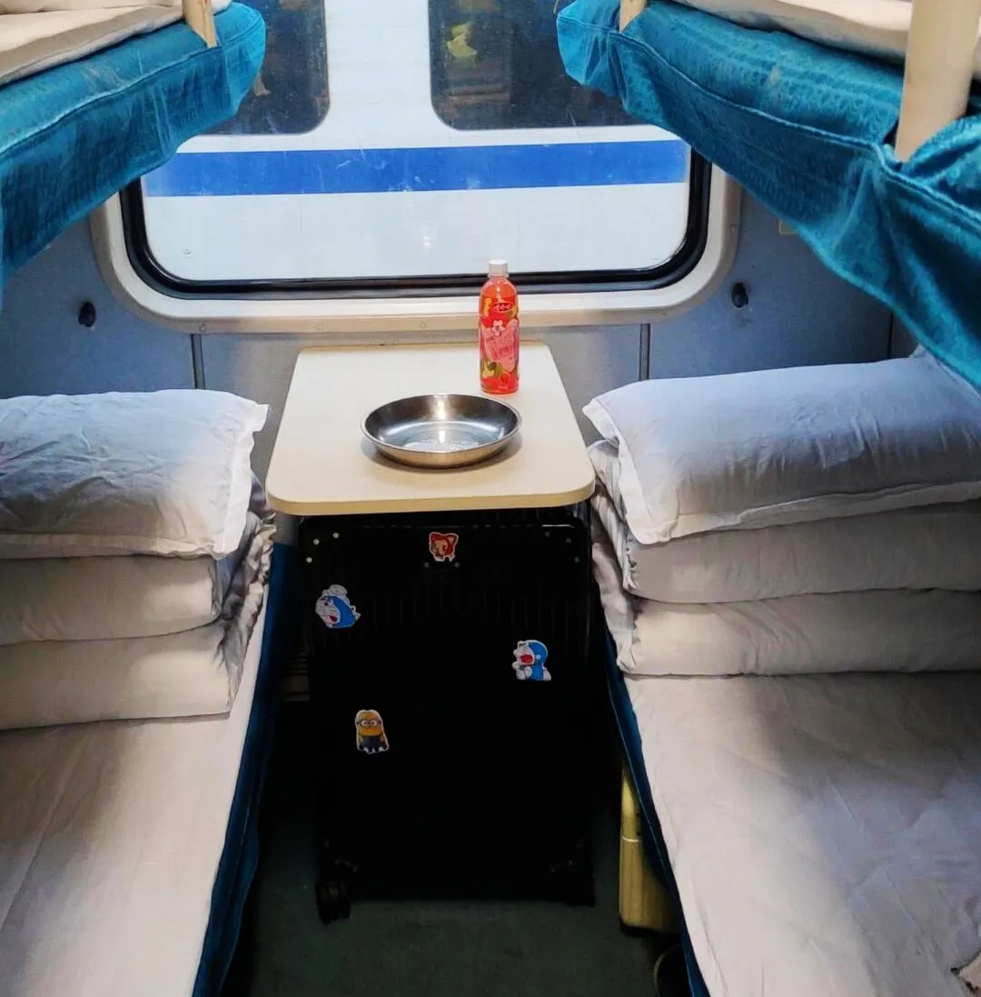 Suitcase Stored Under Lower Bunk on Sleeper Train